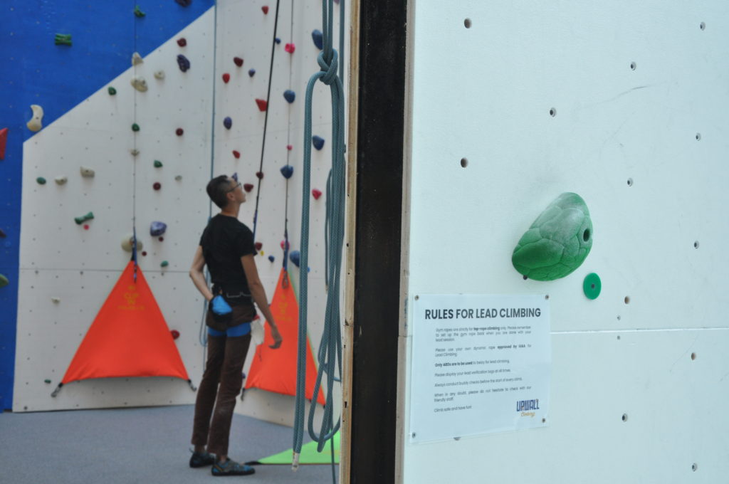 man climbing in upwall